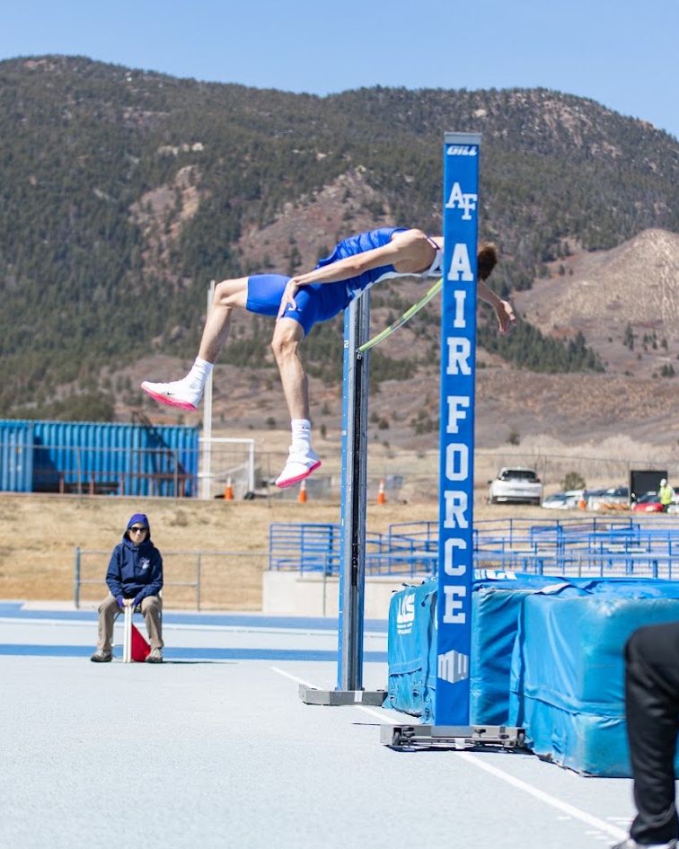 Jake clearing the bar at a high jump meet at the Air Force Academy track